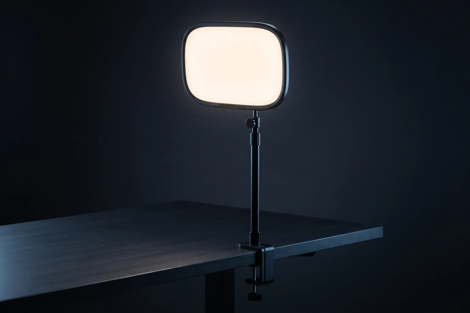 Elgato Key Light Air clamped to a desk, the panel glowing