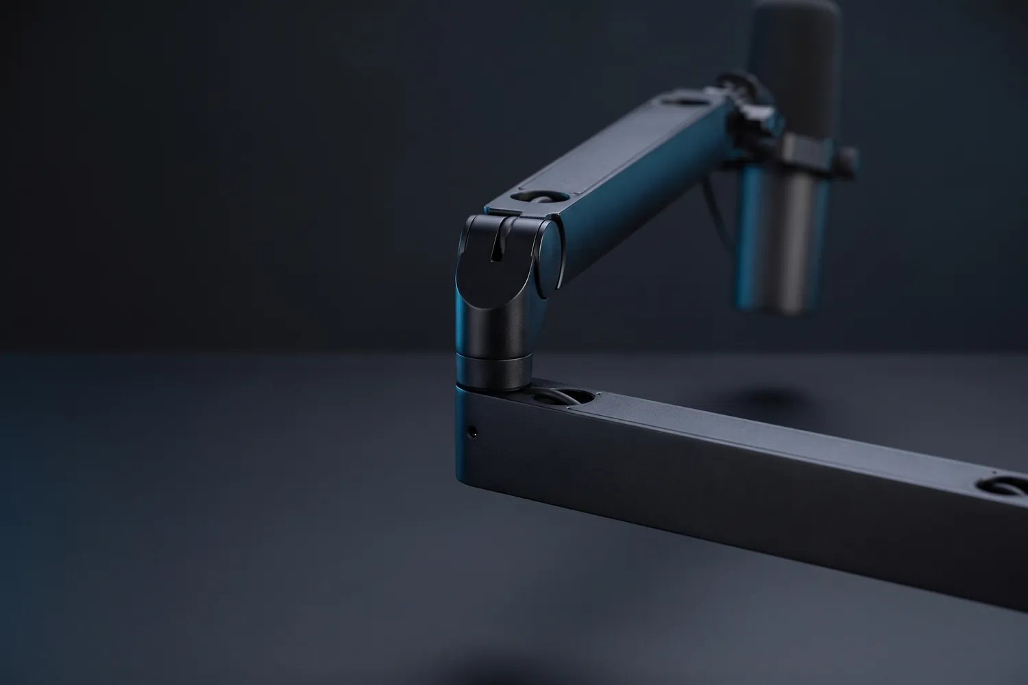 Close-up of the Elgato Wave Mic Arm LP's hinge and flat arm segments