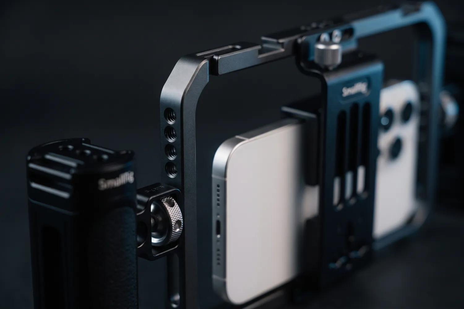 Close-up of a SmallRig handle and the cage's phone clamp