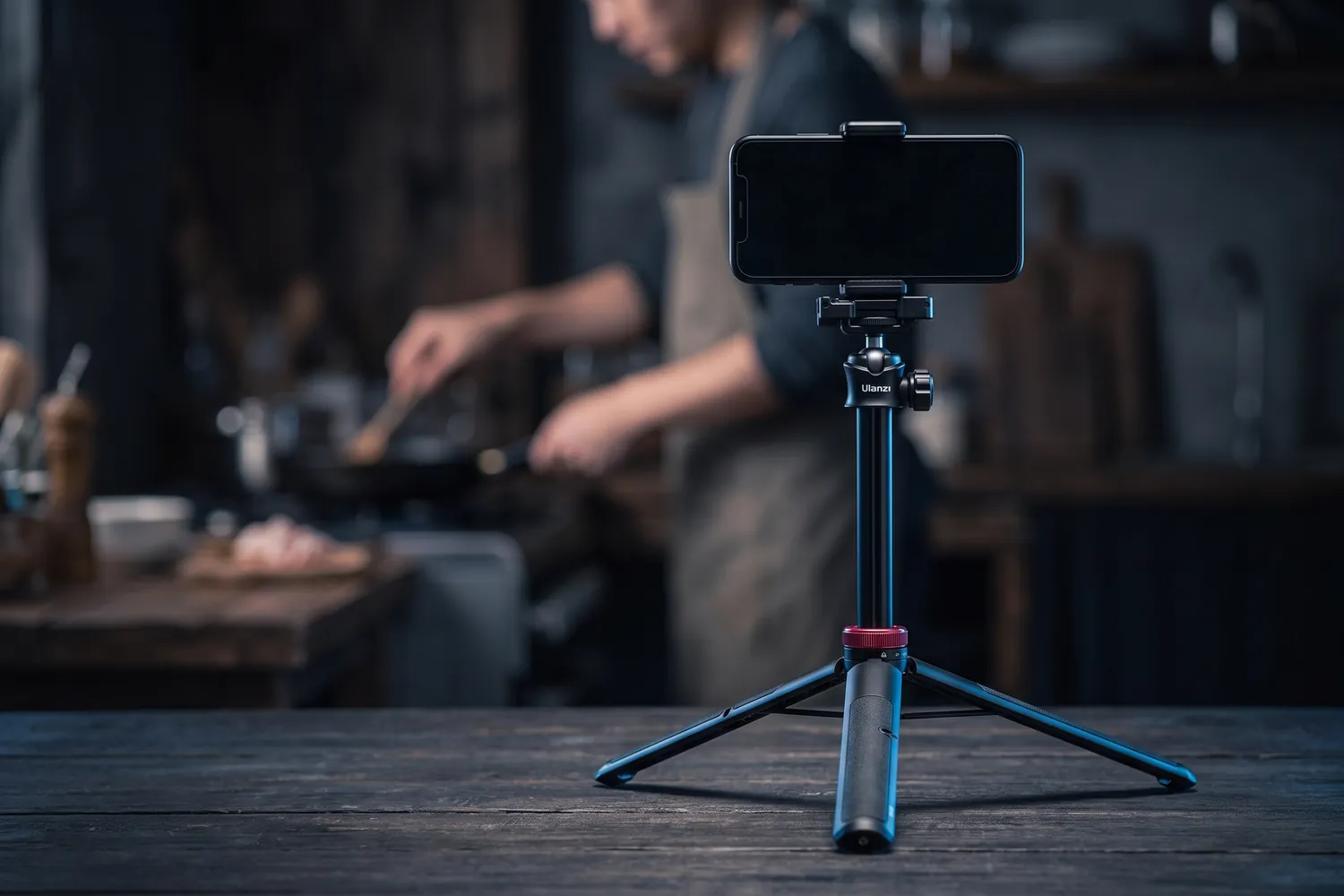 Ulanzi MT-44 holding a phone on a kitchen table, filming someone cooking